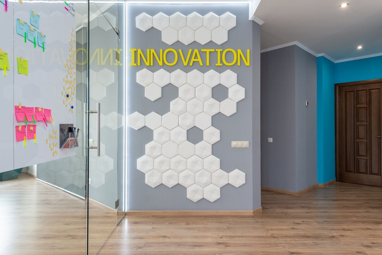 Contemporary office lobby with innovation theme featuring hexagon wall decor and colorful notes.